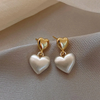 Boucles d'oreilles élégantes en forme de cœur en perles dorées