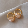 Boucles d'oreilles élégantes en or avec perles roses