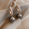 Boucles d'oreilles de luxe avec perles et zircons